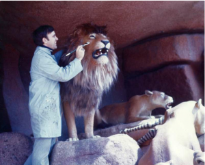 R.J. painting a lion on Jungle Cruise