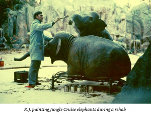 R.J. painting elephants during Jungle Cruise refurb